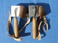 Left-handed and right-handed spoon knives.